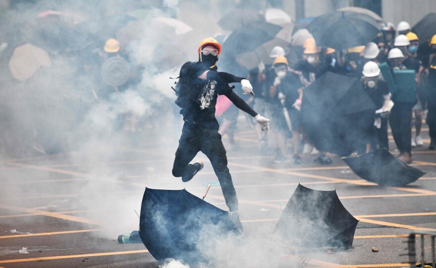Faceoffs between protesters and police broke out during a demonstration in the district of Yuen Long in Hong Kong on Saturday.