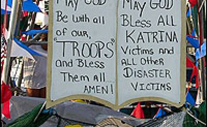 A sign on a fishing boat offers a prayer for a nation's struggle at home and abroad.