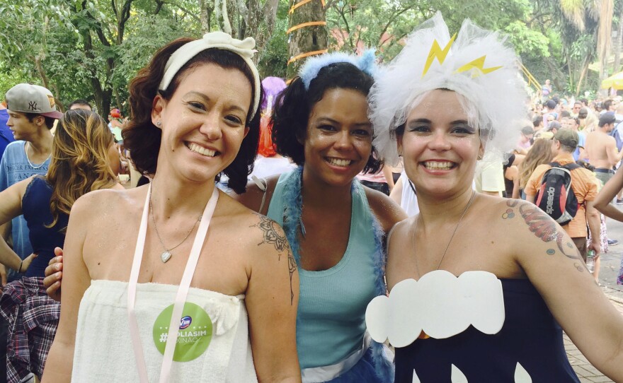 Renata Cabral (left), Luciana Figueredo (right) and a friend dressed in water-themed costumes at a pre-Carnival block party in Sao Paulo. "It's Carnival and we can't forget it's a reality the water is finishing and we have to do something," said Cabral.