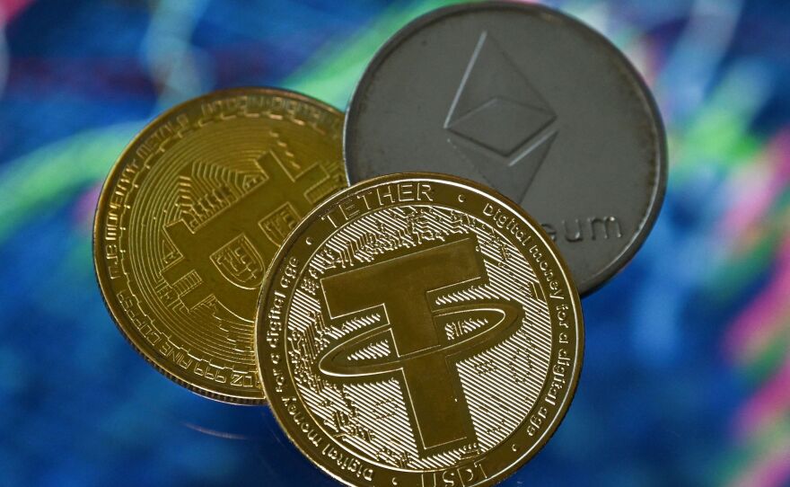 BlockFi, a cryptocurrency lender, has filed for Chapter 11 bankruptcy. Here, an illustration picture shows gold plated souvenir cryptocurrency Tether, Bitcoin and Etherium coins.