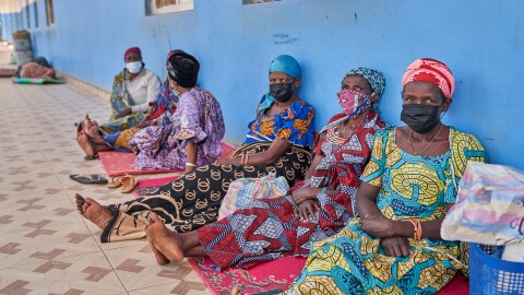 People in protective masks wait in the corridor of a hospital in Bunia, Congo, Tuesday, May 19, 2026.