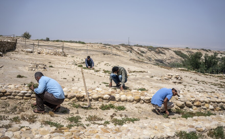 Workers maintaining the grounds of the baptism site, a major religious pilgrimage tourist destination in Jordan. The site has been closed to tourists and pilgrims because of the coronavirus pandemic but staff are preparing it for an eventual reopening.