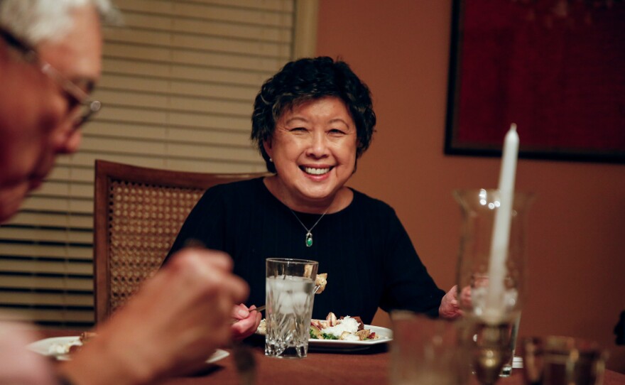 Sally Chow shares a meal with friends and family in her home in Clarksdale, Miss.,