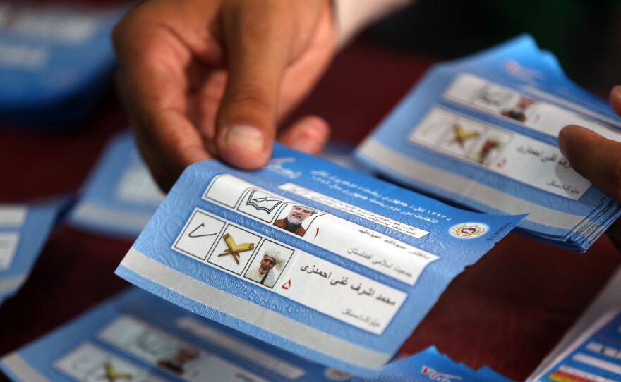 Afghan election commission worker sorts ballots for an audit.
