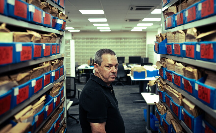 Amos Harel, defense analyst for the Israeli daily Haaretz, stands inside the newspaper's archival library in Tel Aviv.