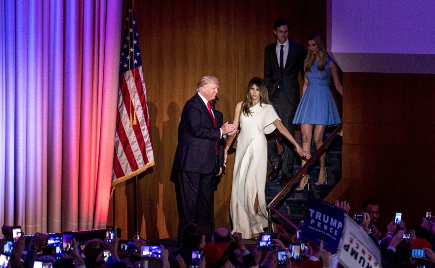 Donald Trump escorts his wife, Melania, to the stage moments before giving his acceptance speech.