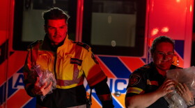 Paramedics work at the Wainwright Health Centre as injured military members are treated after a fire at Canadian Forces Base Wainwright, outside of Wainwright, Alberta Saturday, Oct. 17, 2026.