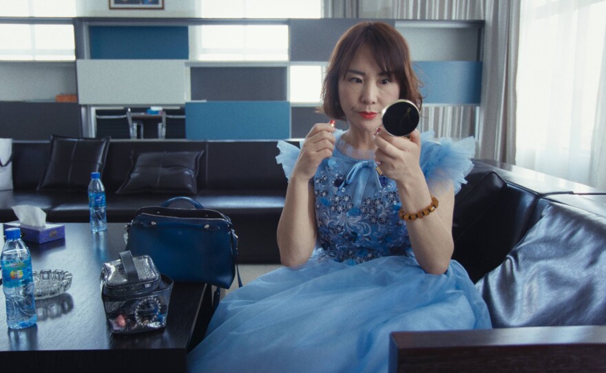 Chinese businesswoman Motto Ma wearing a blue ballgown in her office ahead of celebrations for the Chinese New Year at the Eastern Industry Park, Oromia Region, Ethiopia.