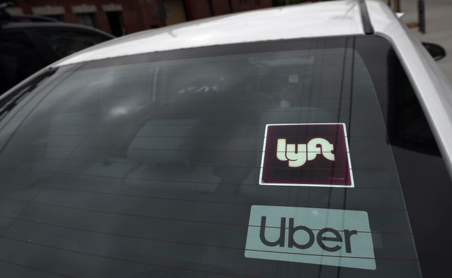 An appeals court has given Uber and Lyft more time to fight a judge's order over how they classify their drivers, averting a shutdown.