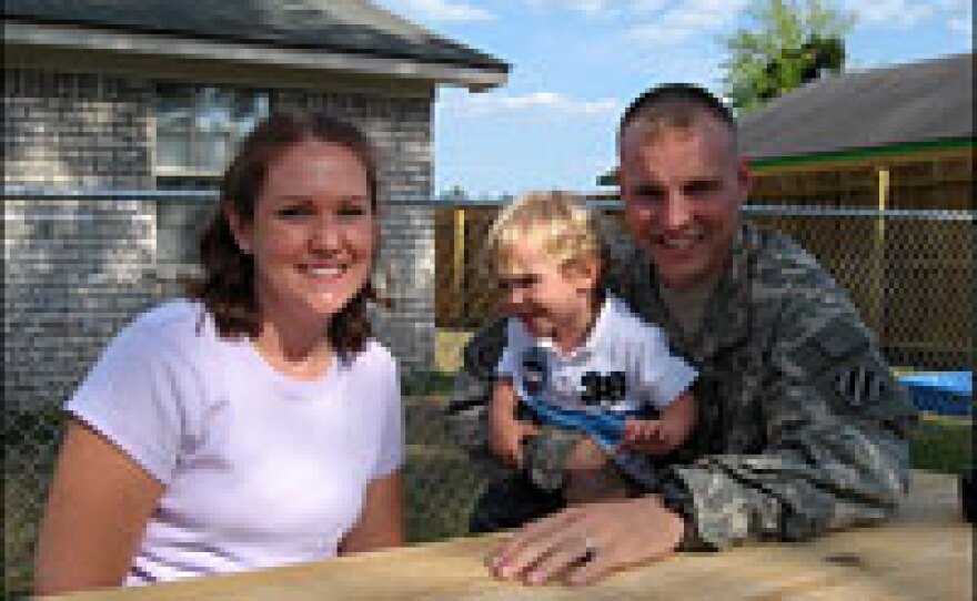 Ruth, Drew and Staff Sgt. Andy DeUnger spend family time together in their backyard. The soldier says being away from his family is difficult; he expects the family to be the same when he returns as when he left, but it isn't.