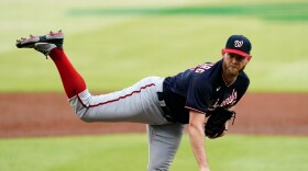 Former Washington Nationals starting pitcher Stephen Strasburg follows through on a pitch in the first inning of a baseball game against the Atlanta Braves, June 1, 2021, in Atlanta.