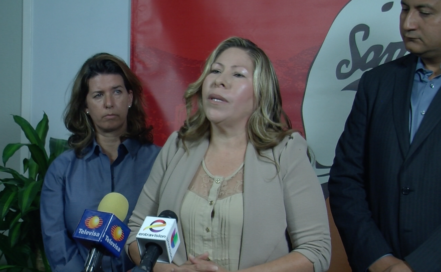 Maria Puga speaks at a press conference, April 14, 2015.