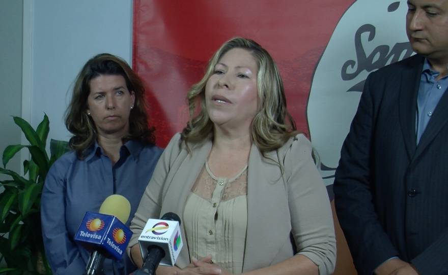 Maria Puga speaks at a press conference, April 14, 2015. 