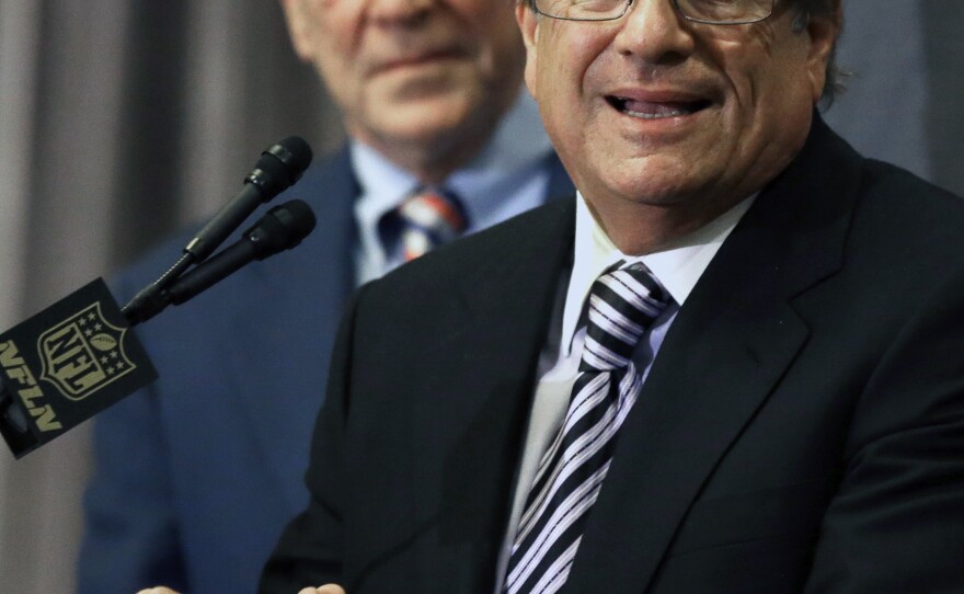 Houston Texans owner Bob McNair, left, listens as San Diego Chargers owner Dean Spanos talks to reporters after team owners voted to allow the St. Louis Rams to move to a new stadium in Inglewood, and the Chargers will have an option to share the facility, Jan. 12, 2016.