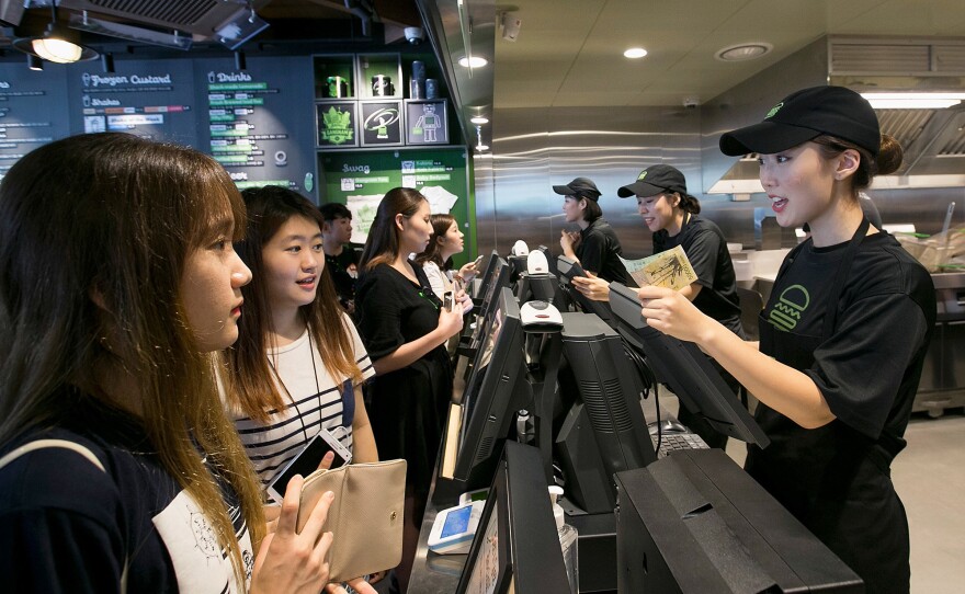 South Korean customers place orders at the July opening for Shake Shack's store in Seoul's hip Gangnam District.
