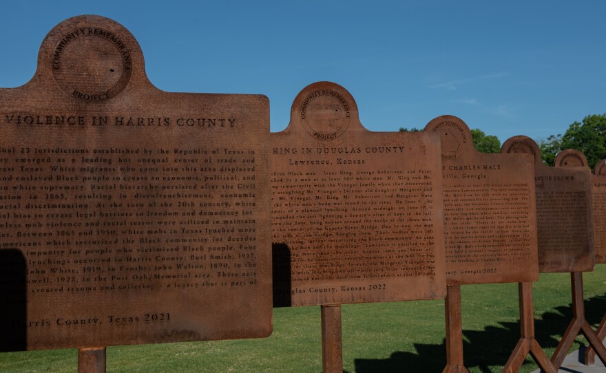 Duplicates of new markers line the pathway at the National Memorial for Peace and Justice in Montgomery. The Equal Justice Initiative has worked with more than 100 communities to help put up markers telling the stories of lynchings and racial terror.