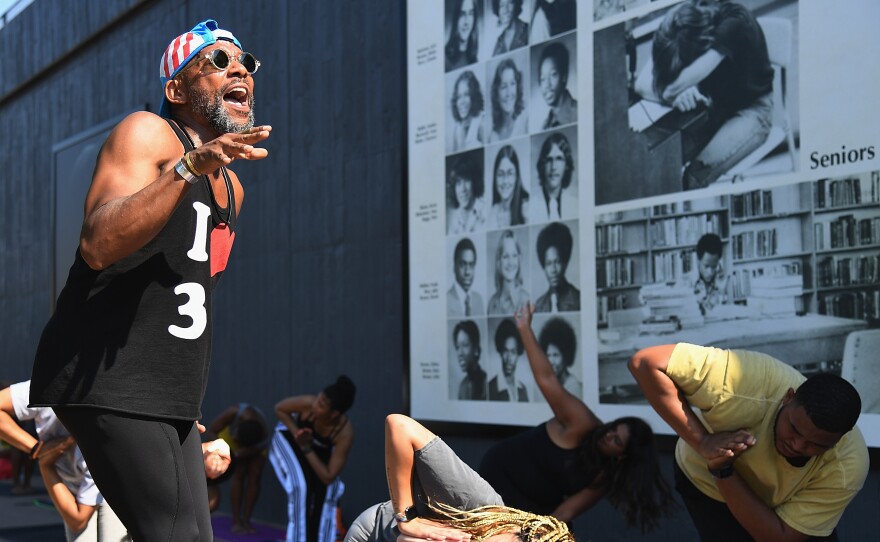 Marlon F. Hall leads a yoga class next to Interstate 244, which runs through the Tulsa neighborhood of Greenwood, the location of the <a href="https://www.npr.org/series/1001433852/the-tulsa-race-massacre">Tulsa Race Massacre</a> 100 years ago. Tulsa's celebration of Juneteenth comes less than three weeks after the anniversary.