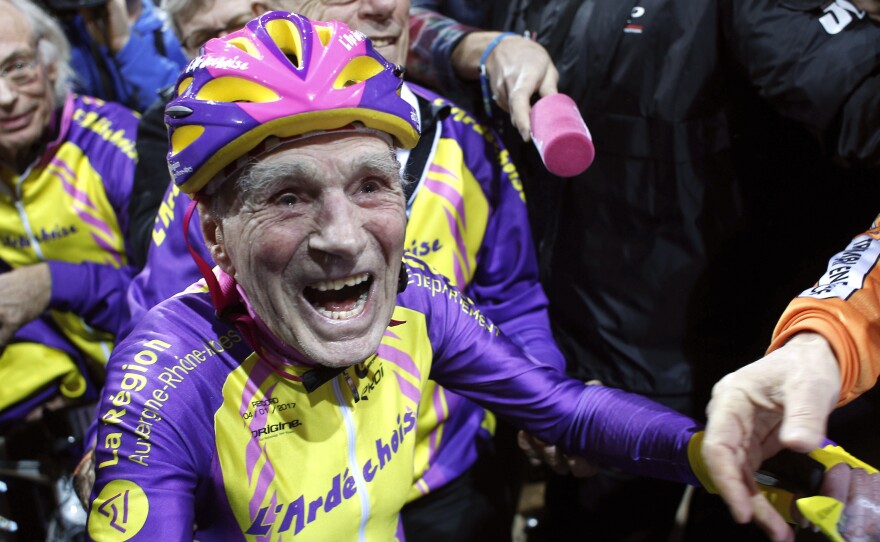 French cyclist Robert Marchand, 105, reacts after setting a record for distance cycled in one hour, at the velodrome of Saint-Quentin en Yvelines, outside Paris on Wednesday.