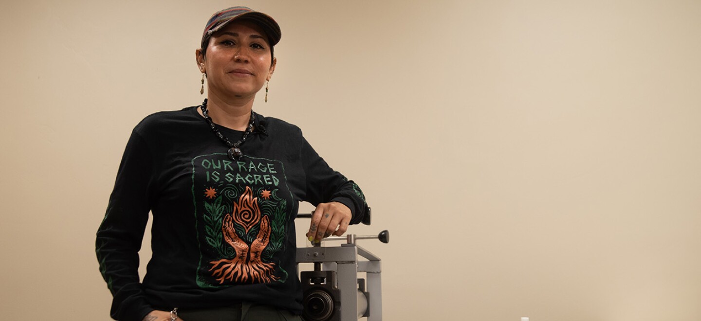 Irie Zepeda is founder of the Barrio Logan-based Por la Mano Press, shown in the new printmaking studio at the Chicano Park Museum and Cultural Center on Oct. 7, 2025. "You don't have to ask anyone else. It's just right there in front of you," they said of DIY printmaking as an art form.