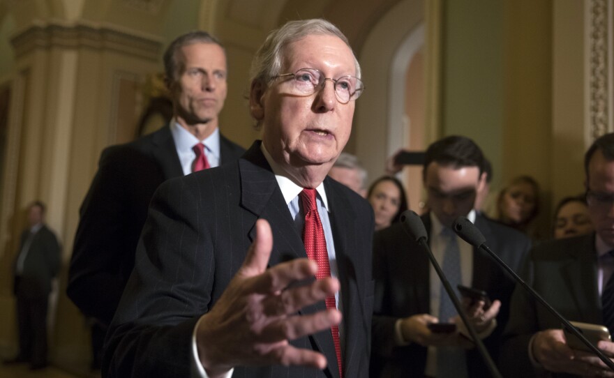 Senate Majority Leader Mitch McConnell, R-Ky., and Sen. John Thune, R-S.D., at a news conference on Tuesday where they announced that the individual mandate to have health insurance would be repealed in the Senate GOP tax bill.