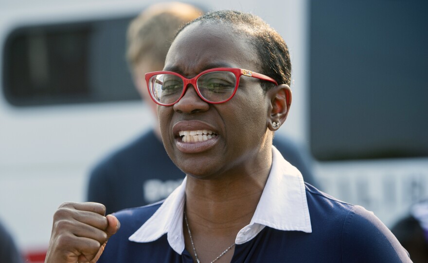 Nina Turner, a candidate running in a special Democratic primary for Ohio's 11th Congressional District, speaks with supporters near the Cuyahoga County Board of Elections in Cleveland before casting her early vote on July 7.