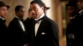Chiwetel Ejiofor as Louis (center), with band members, Miles Brett as band member six on tenor sax, in a scene from DANCING ON THE EDGE.