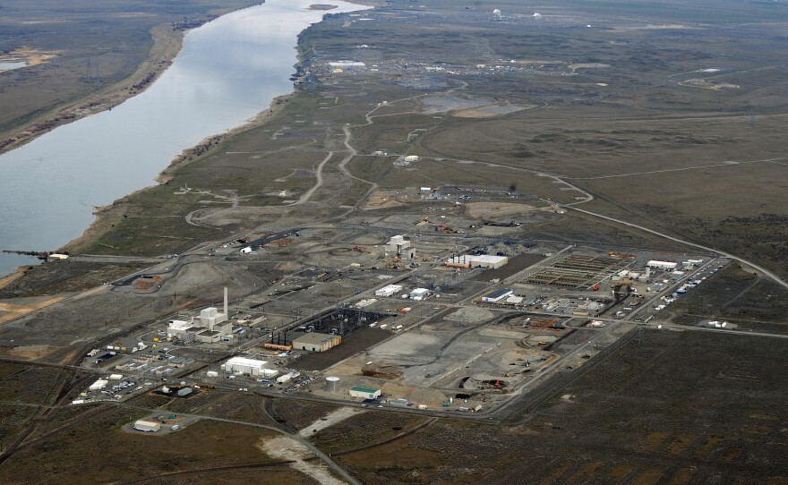 Workers demolish a decommissioned nuclear reactor during the cleanup operations at the nuclear site in Hanford, Wash., in 2011.