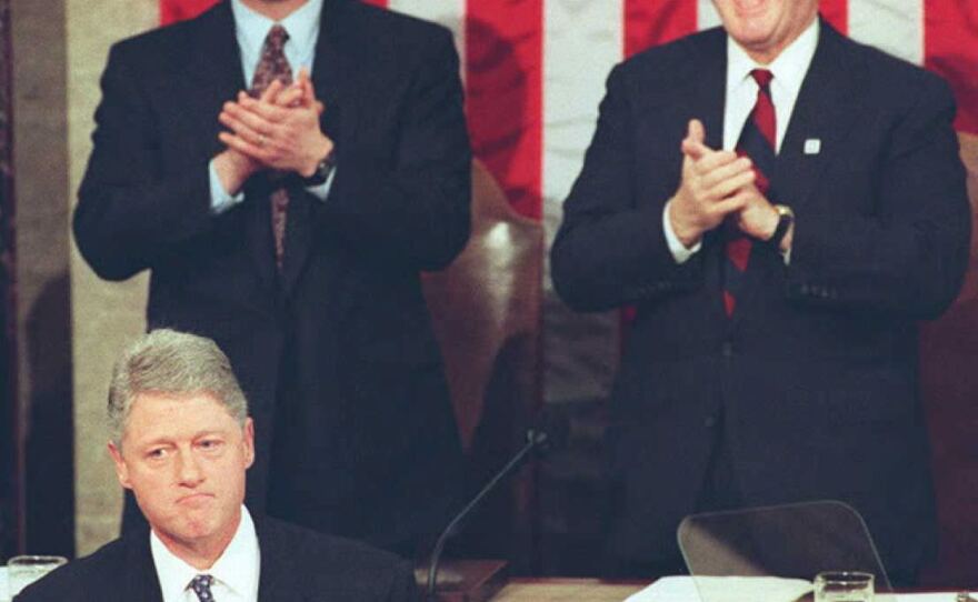 House Speaker Newt Gingrich (above right) laughs and applauds during President Bill Clinton's State of the Union address on Jan. 24, 1995. Republicans had just taken control of both chambers of Congress in November's midterm elections.