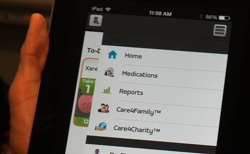 A patient uses the Care-4-Today health manager app in this undated photo.