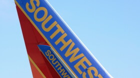 A Southwest Airlines passenger plane taxis on the tarmac at Los Angeles International Airport. Southwest and other smaller carriers have filed a lawsuit against new rules regarding airfare advertisements.