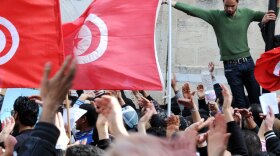 Thousands of people rally in Tunis on Feb. 20, demanding the government's resignation and a new constitution.
