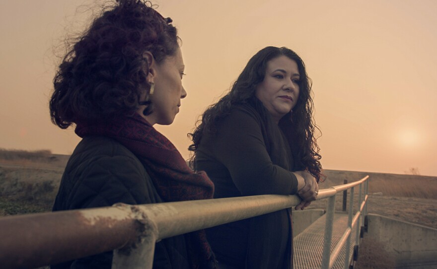 Jasmin Mara López looking out with her aunt.