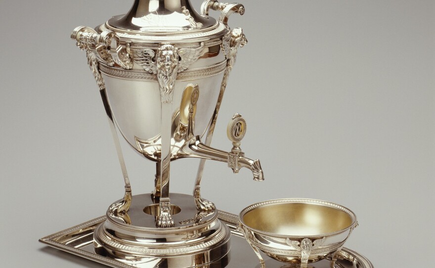 This samovar, made in Moscow in 1909, was part of a grand tea set crafted by the First Silver Artel, a firm that often, as in this case, supplied works to the Faberge firm for retail. The marks of both Faberge and the First Silver Artel appear on the samovar.