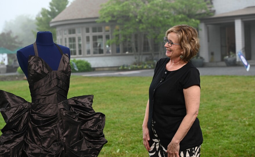 ANTIQUES ROADSHOW guest reacts as their 1948 Gilbert Adrian silk taffeta gown is appraised in Boothbay, Maine. ANTIQUES ROADSHOW “Coastal Maine Botanical Gardens, Hour 3” premieres Monday, March 23 at 8/7C PM on PBS.
