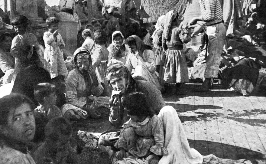 An encampment of Armenian refugees on the deck of a French cruiser that rescued them in 1915 during the massacre of the Armenian populations in Turkey.