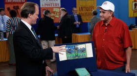 At ANTIQUES ROADSHOW in El Paso, Texas, book expert Ian Ehling (left) has his day made when he comes across a 1937 first edition copy of "The Hobbit," with the original dust jacket. Signed by author J.R.R. Tolkien's, Ehling values the literary treasure at $80,000 to $120,000.