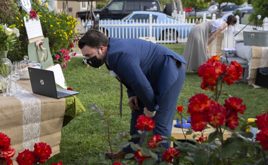 Sean Widger and his fiancé Lindsey Dale joined a video conference call in Livermore, Calif., with family and friends on May 2. The couple postponed their long-planned wedding until after the pandemic's restrictions ease, but decided to host a socially distant "non-wedding reception" this summer.<em> </em>