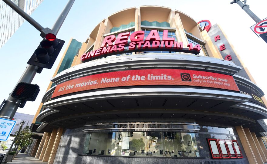 Regal Cinemas says it will reopen its U.S. theaters next month. A closed box office is seen here in Los Angeles in June, after theaters were closed due to the pandemic.