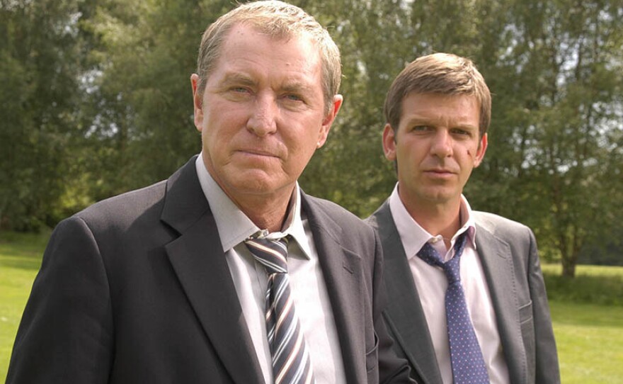 A scene from MIDSOMER MURDERS Season 12, featuring John Nettles as Barnaby Jones, Jason Hughes as DS Ben Jones