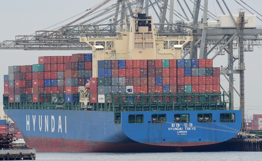 A container ship is unloaded at the Port of Los Angeles. Voters in this year's presidential election have deep feelings about trade — and often are at odds with each other about it.