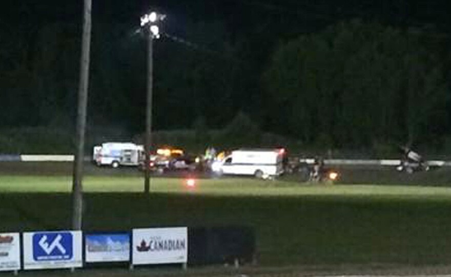 Ambulances converge Aug. 9 on the racetrack at Canandaigua Motorsports Park in upstate New York, where sprint car racer Kevin Ward Jr. was hit and killed by Tony Stewart.