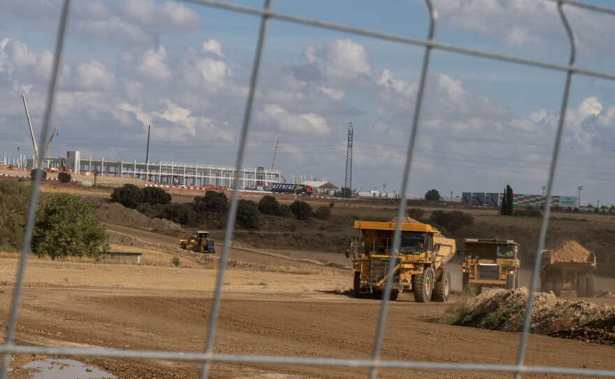 Heavy equipment excavates an area adjacent to an Amazon data center currently under construction in Cuarte, Spain, on Sept. 29. Local authorities have approved dozens of data center projects for U.S. Big Tech and other companies that will transform the character of this region.