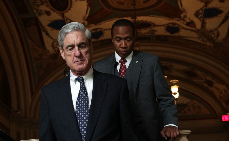 Special counsel Robert Mueller (left) arrives at the U.S. Capitol for a closed meeting with members of the Senate Judiciary Committee on June 21.