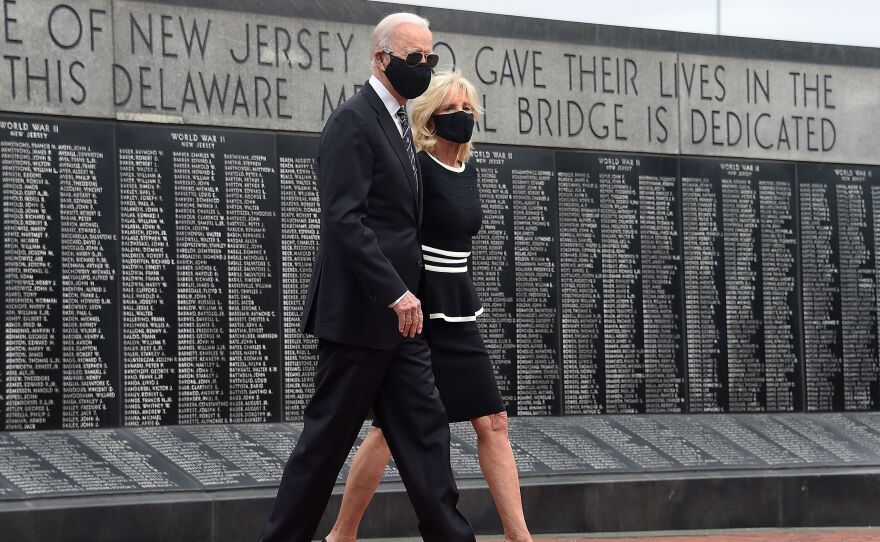 Joe Biden and his wife Jill Biden wear masks as they mark Memorial Day, on May 25. The president-elect has consistently worn masks amid the pandemic, and is calling for a national mask mandate.