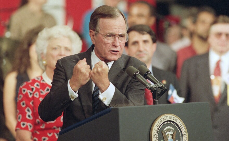 George H.W. Bush shakes his fists during a speech to supporters in 1992 at the Republican National Convention in Houston.