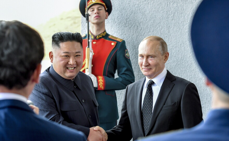 Russian President Vladimir Putin, center right, and North Korea's leader Kim Jong Un shake hands during their meeting in Vladivostok, Russia, Thursday, April 25, 2019.
