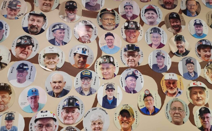 A wall of photos of miners with complicated black lung who received respiratory therapy at New Beginnings Pulmonary Rehab in Norton, Va.