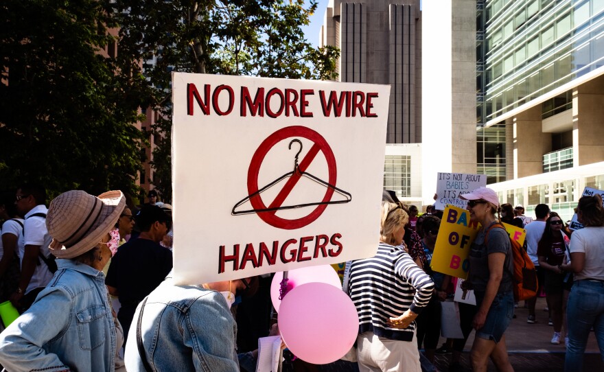 Marchers at the <a  href="https://womensmarchsd.org/calendar-1/2022/5/7/bans-off-our-bodies-san-diego" class="eventlist-title-link" style="color: inherit; background: transparent; text-decoration-line: none; margin: 0px; padding: 0px; font-size: inherit; line-height: inherit;">Bans Off Our Bodies rally and protest march in downtown San Diego</a>, May 14, 2022.