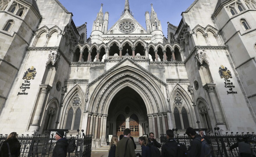 Media gather outside the High Court in London on Thursday for the decision on the challenge to plans for Brexit.