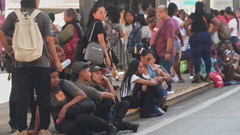 People gather outside shopping mall after an earthquake hit Panama City, Friday, Oct. 9, 2026.